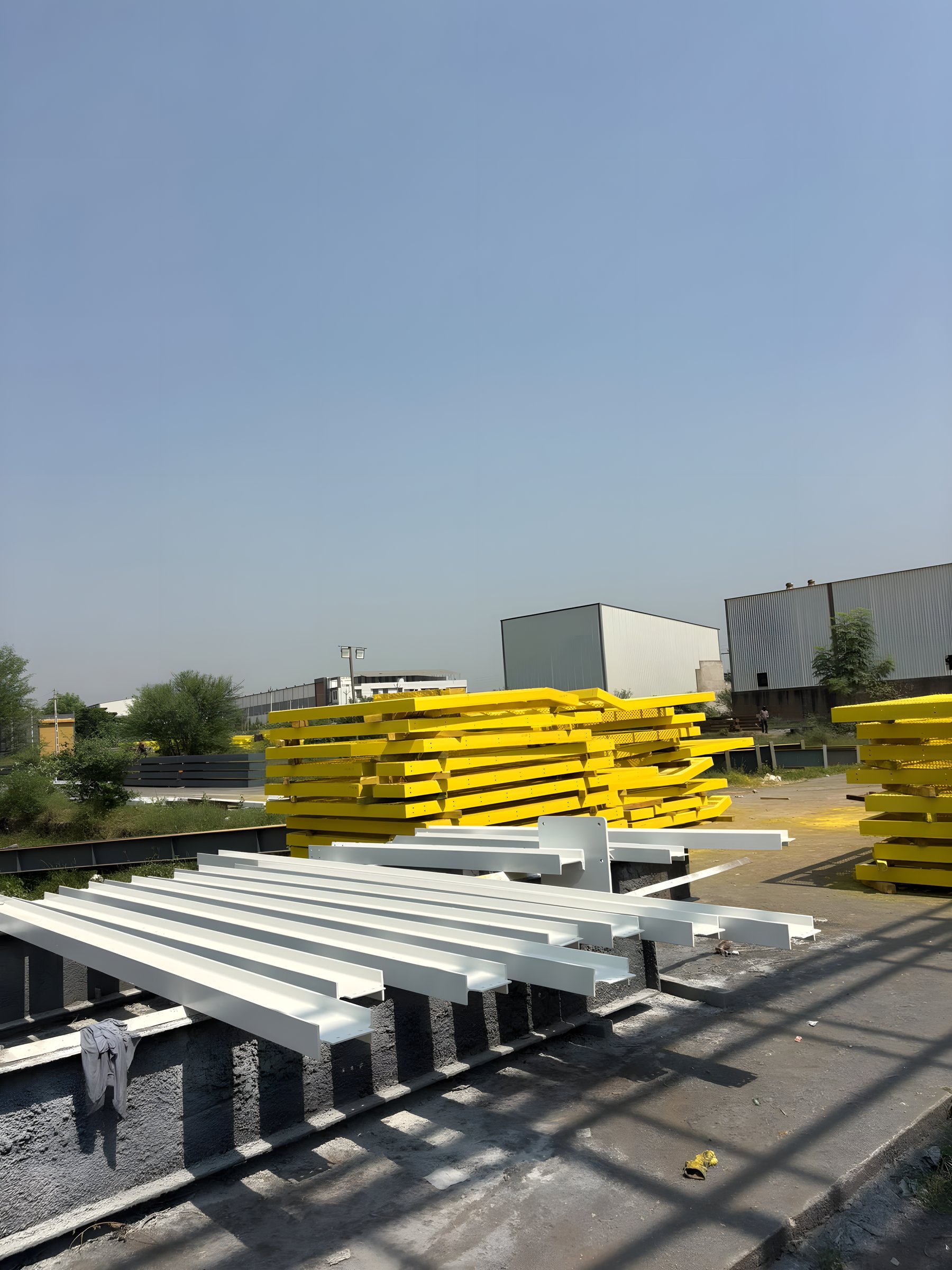 Painted steel members and grating panels ready for dispatch at AcuFabInfraStructure